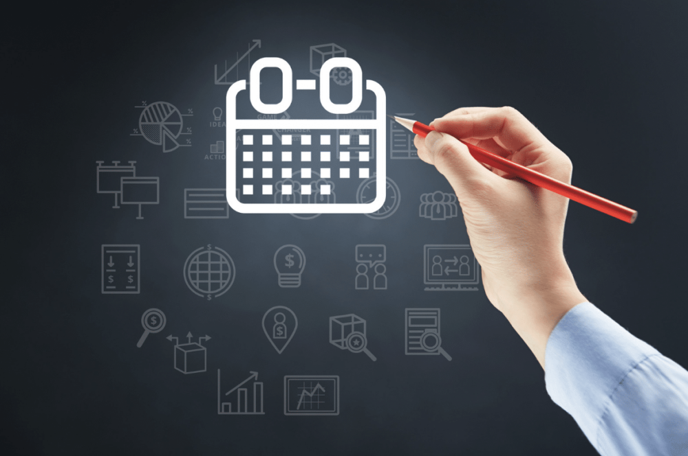 group scheduling tools concept: hand holding pencil over calendar icon