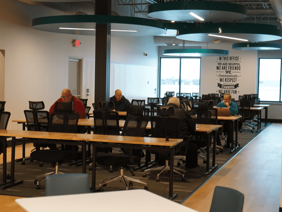 People using shared desks at NuvoDesk coworking space