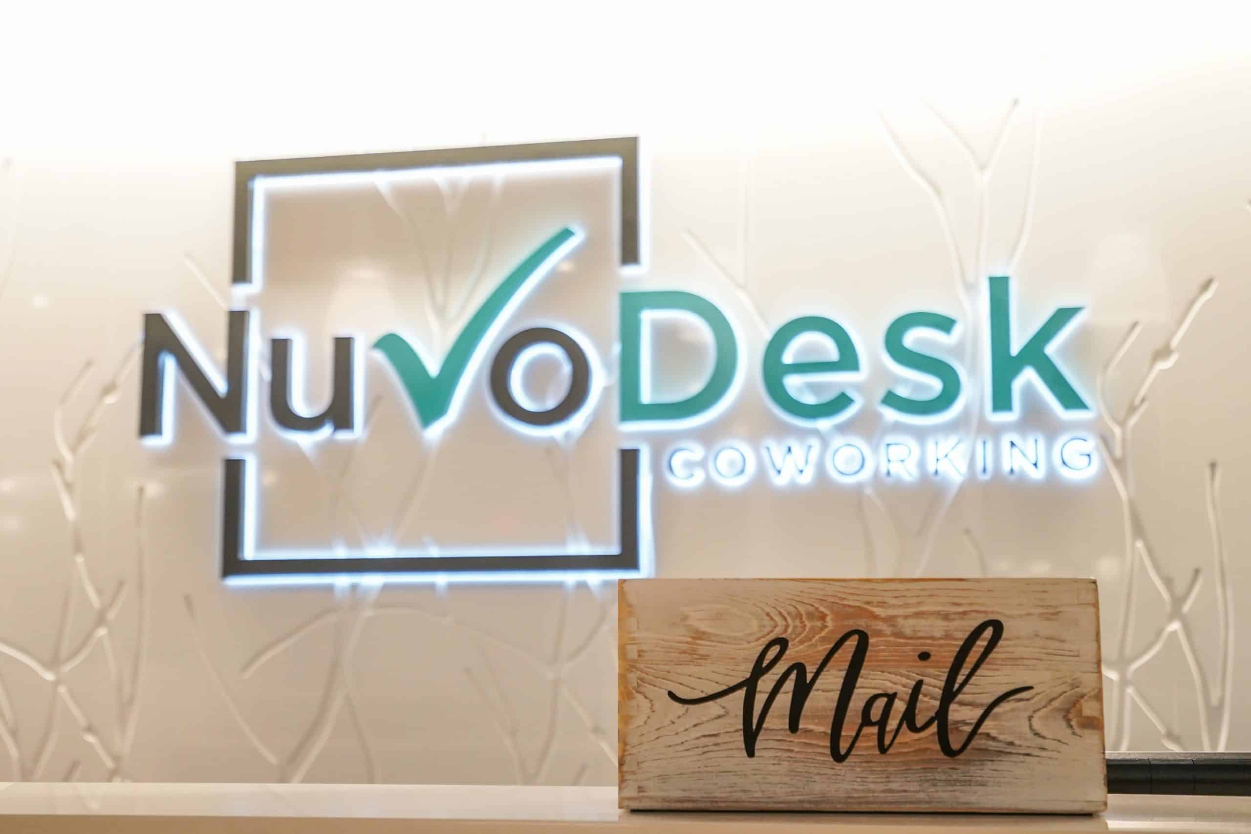 wodden box that says mail in front of the nuvodesk sign