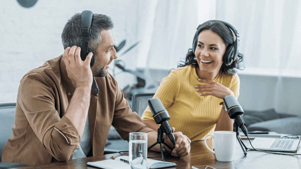 man and woman podcasting