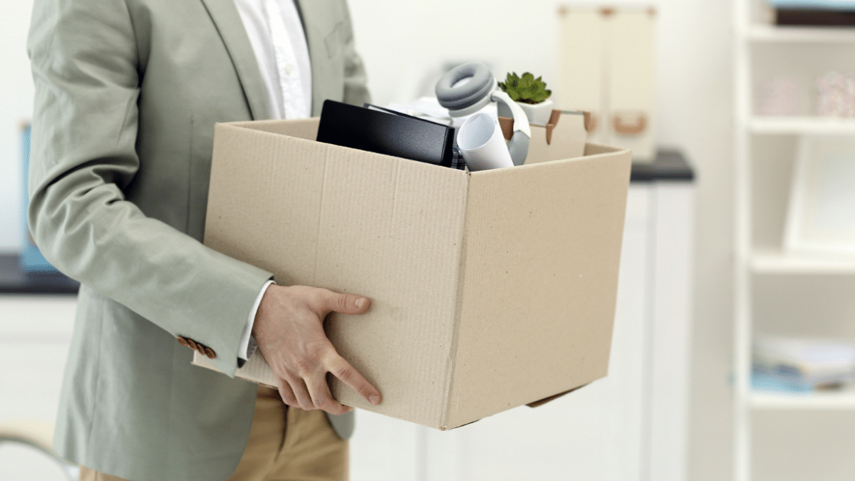 Man holding office moving box.