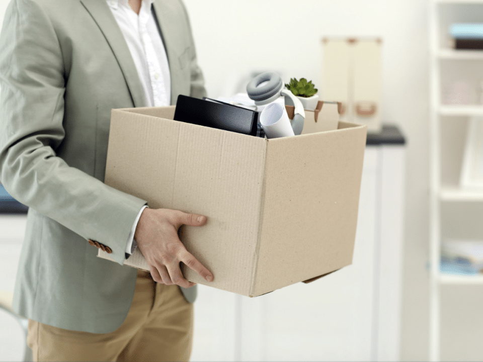 Man holding office moving box.