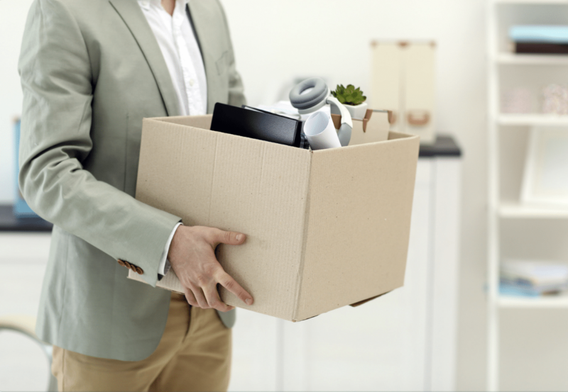 Man holding office moving box.