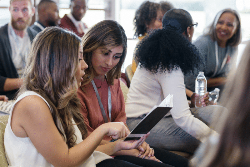 People networking at an event venue.