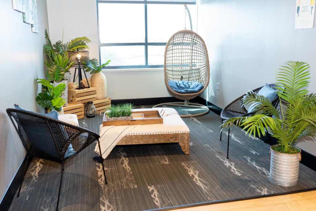 Relaxation nook at Nuvodesk with seating options, plants, window