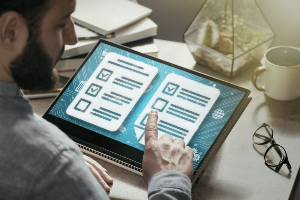 man on tablet checking off boxes. LinkedIn job posting
