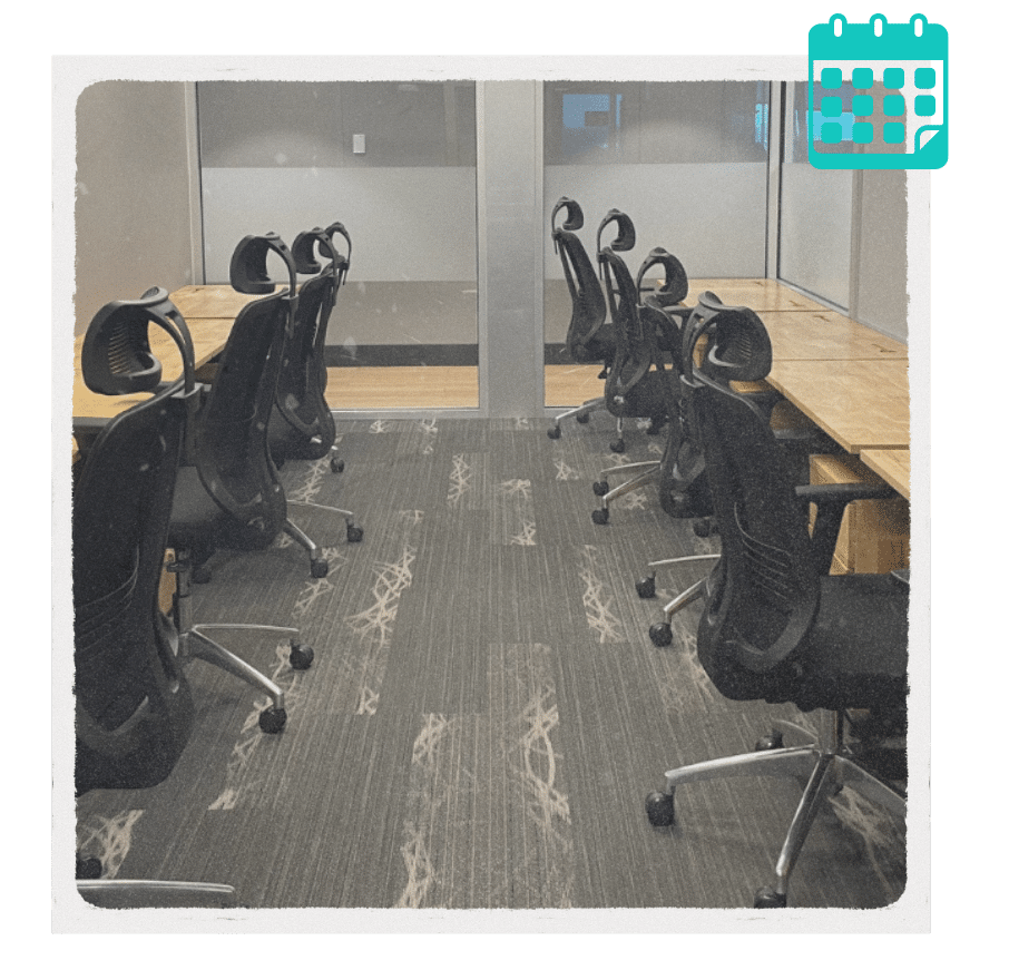 Row of ergonomic chairs and workstations in a quiet NuvoDesk private office area, ideal for focused work or meetings.