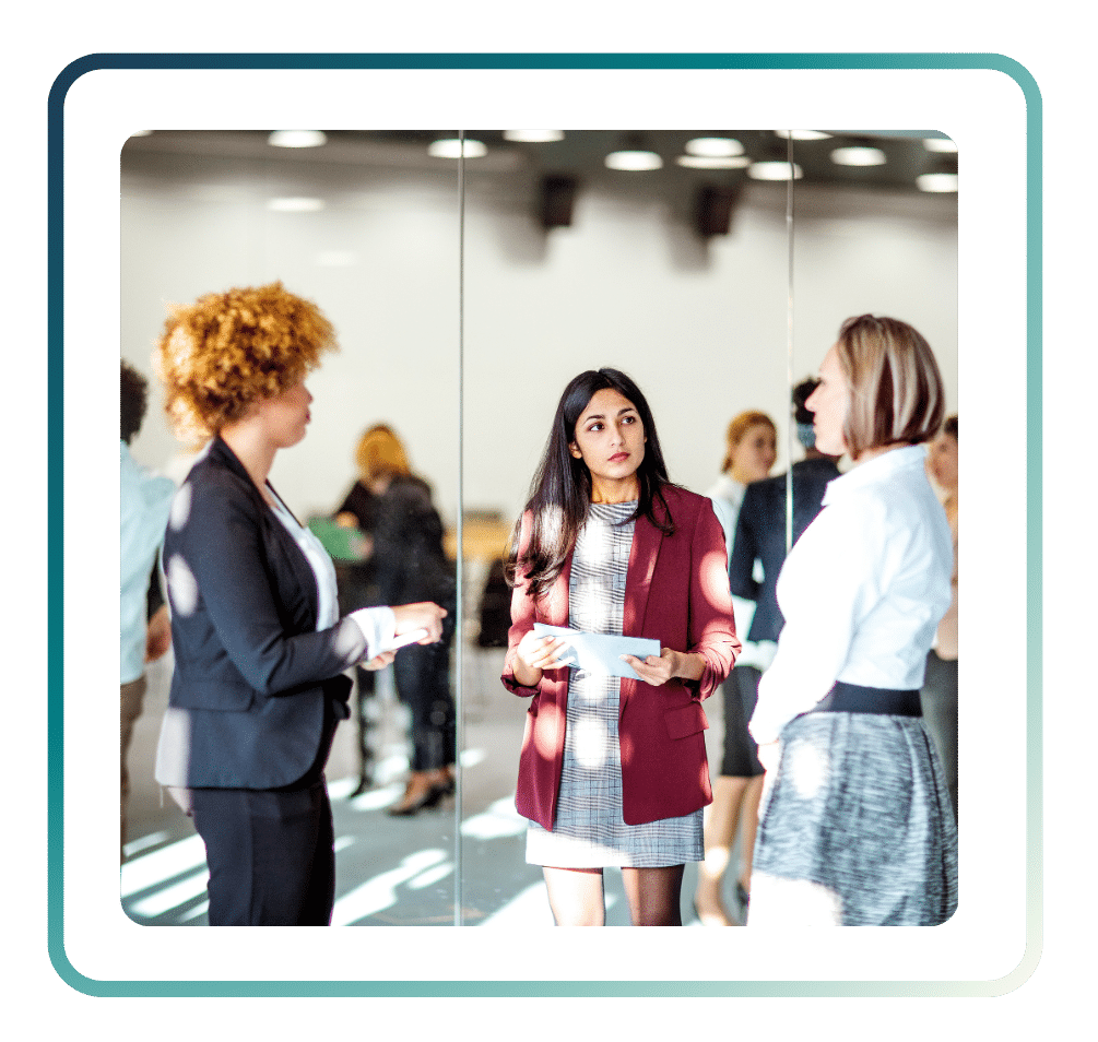 121 ‣ NuvoDesk Coworking Business professionals networking and having a conversation during a NuvoDesk community event